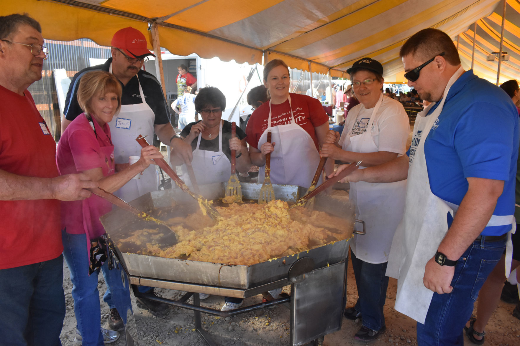 Group of volunteers cook eggs